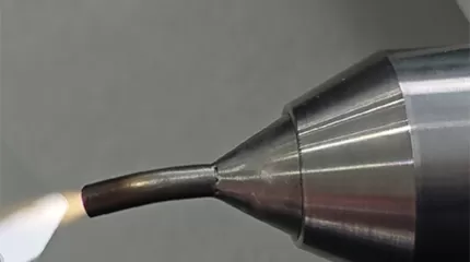 Flawless bonding results thanks to curved nozzle