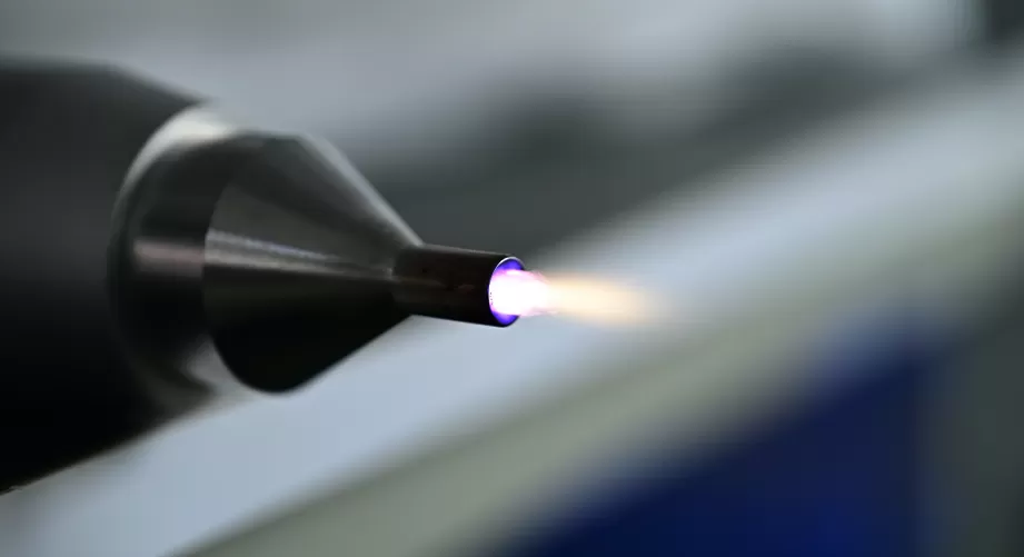 Atmospheric plasma treatment of material surfaces