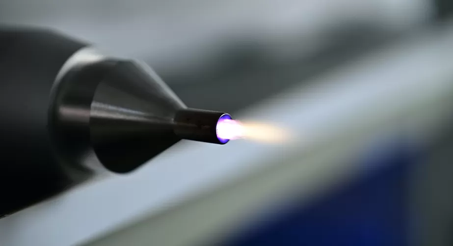 Atmospheric plasma treatment of material surfaces